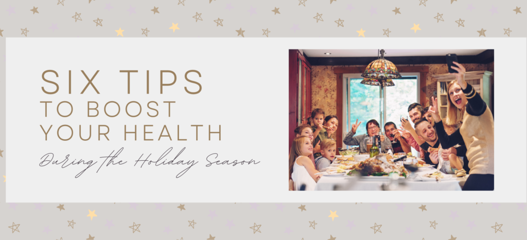 Six tips to boost your health during the holiday season family around a table for a meal taking a photo NORM